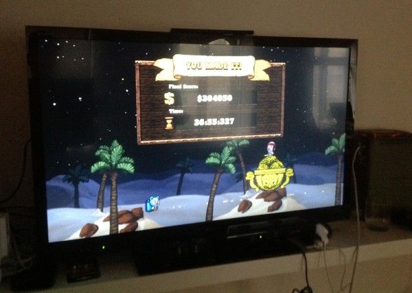 Photo of a TV screen showing a successful "Hell" run of the videogame Spelunky. A user interface menu reads "YOU MADE IT!" and shows a (difficult-to-read) final score above $30,000, and a time above 36 minutes.