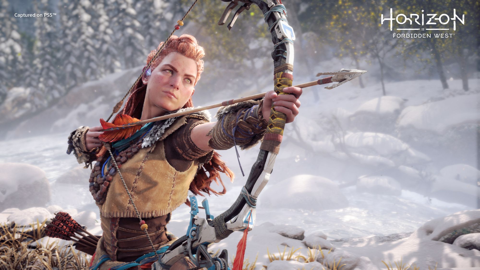 A press image form Horizon Forbidden West, source: presskit - a young white woman with red hair and basic clothing holds a bow and arrow pointed just off screen, against a snowy backdrop